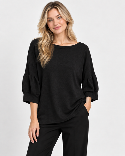 7135 Scoop Jumper with Puff Sleeves in Black, front model view with black trousers